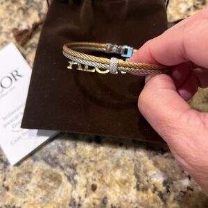 ALOR cable bracelets. 18 carat white and yellow gold bangles.